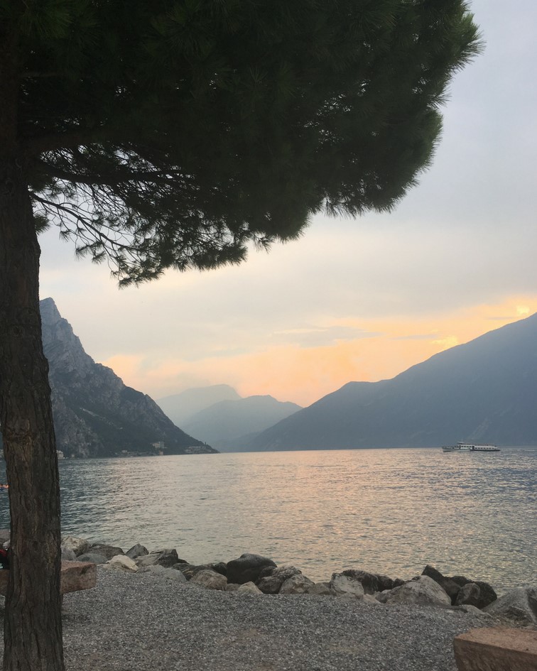Sunset over the lake, looking out from Limone's public beach. Top towns to visit in lake garda spadreams