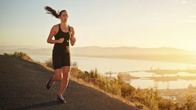 Woman running at sunset