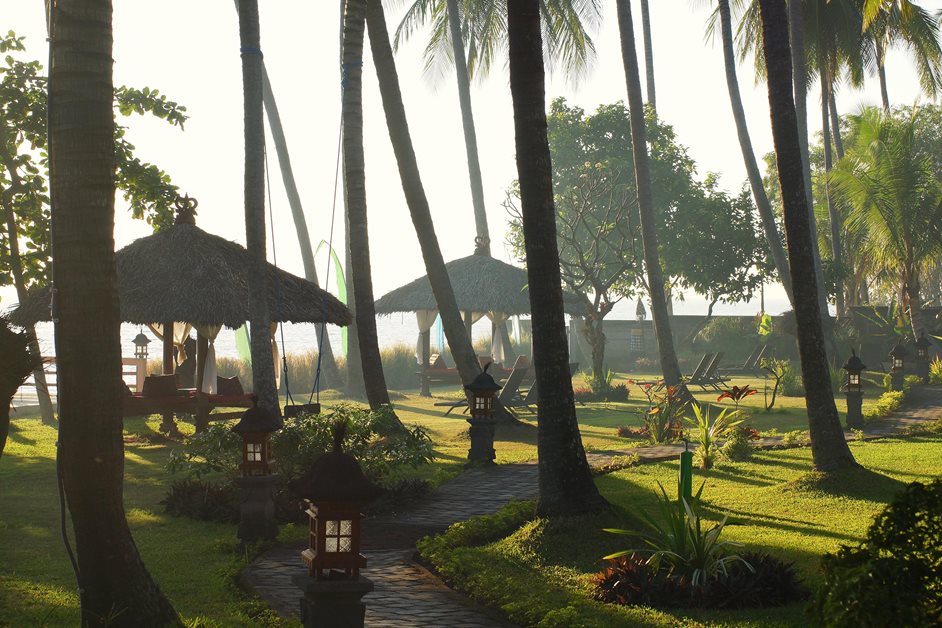 Resort in Bali, beach huts at sunset