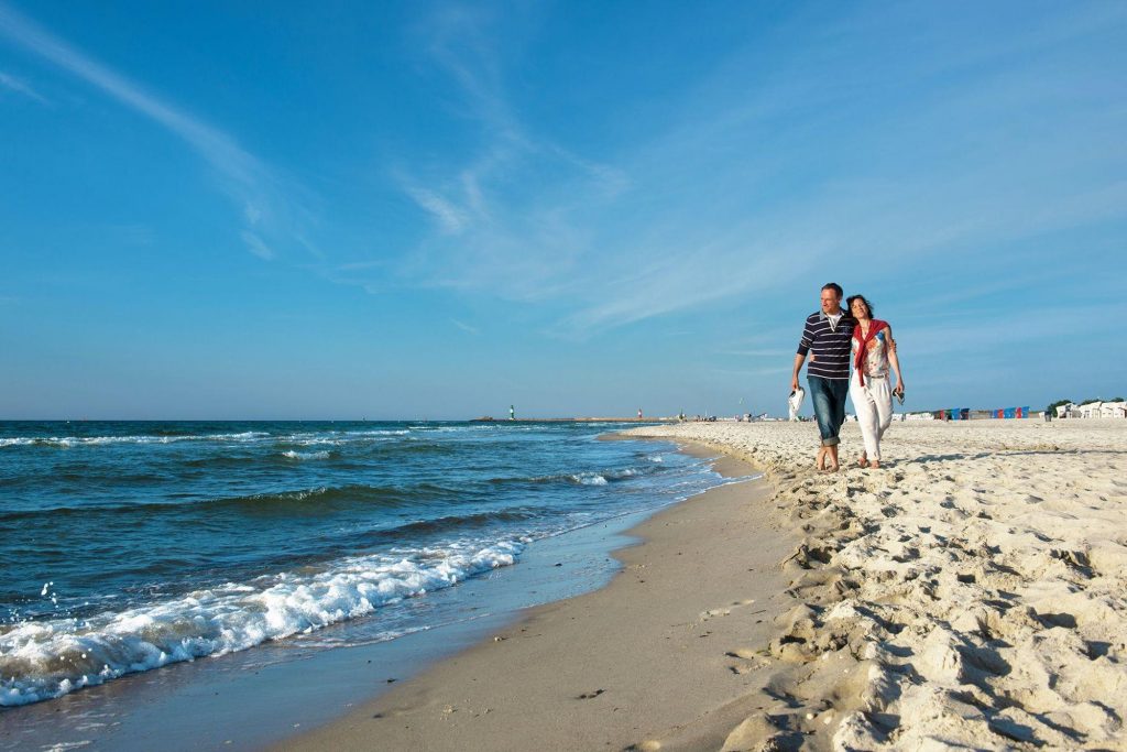 Hotel neptun spa, a couple walking along the baltic sea coast near to the hotel