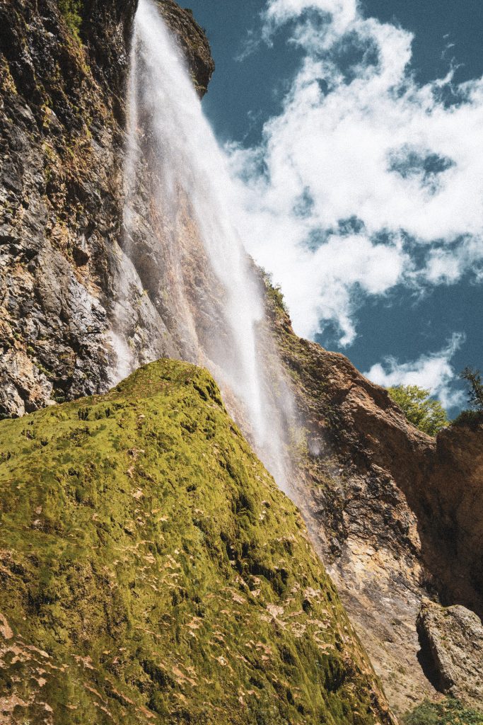 Top part of the beautiful Rinka Waterfall at the end of Logar Valley in Kamnik-Savinja Alps, Slovenia. It is summer time, true Alpine idyll, close to the border with Austria.