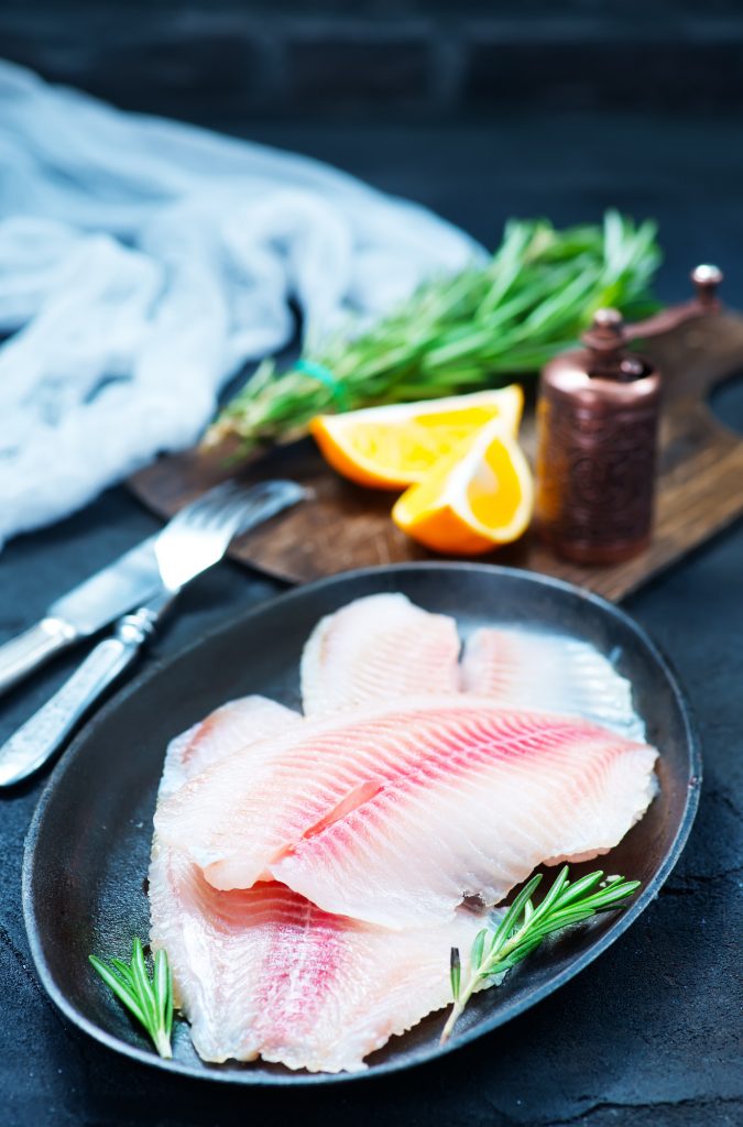 raw fish with spice and on a table