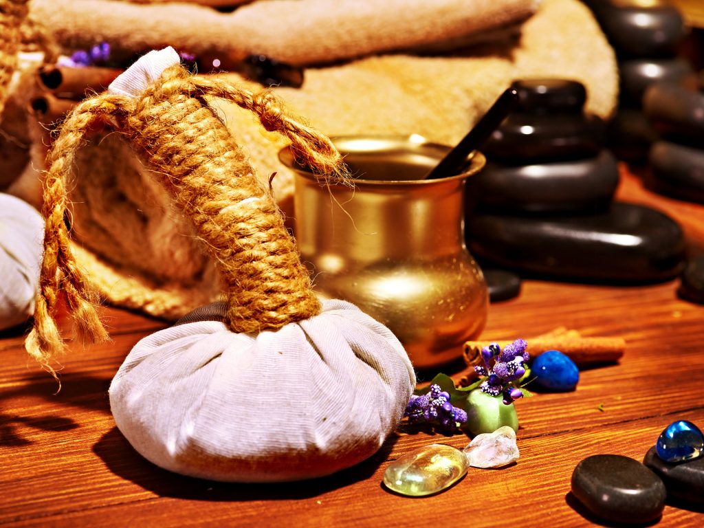 herbal stamp, stones and oils for Ayurveda treatments